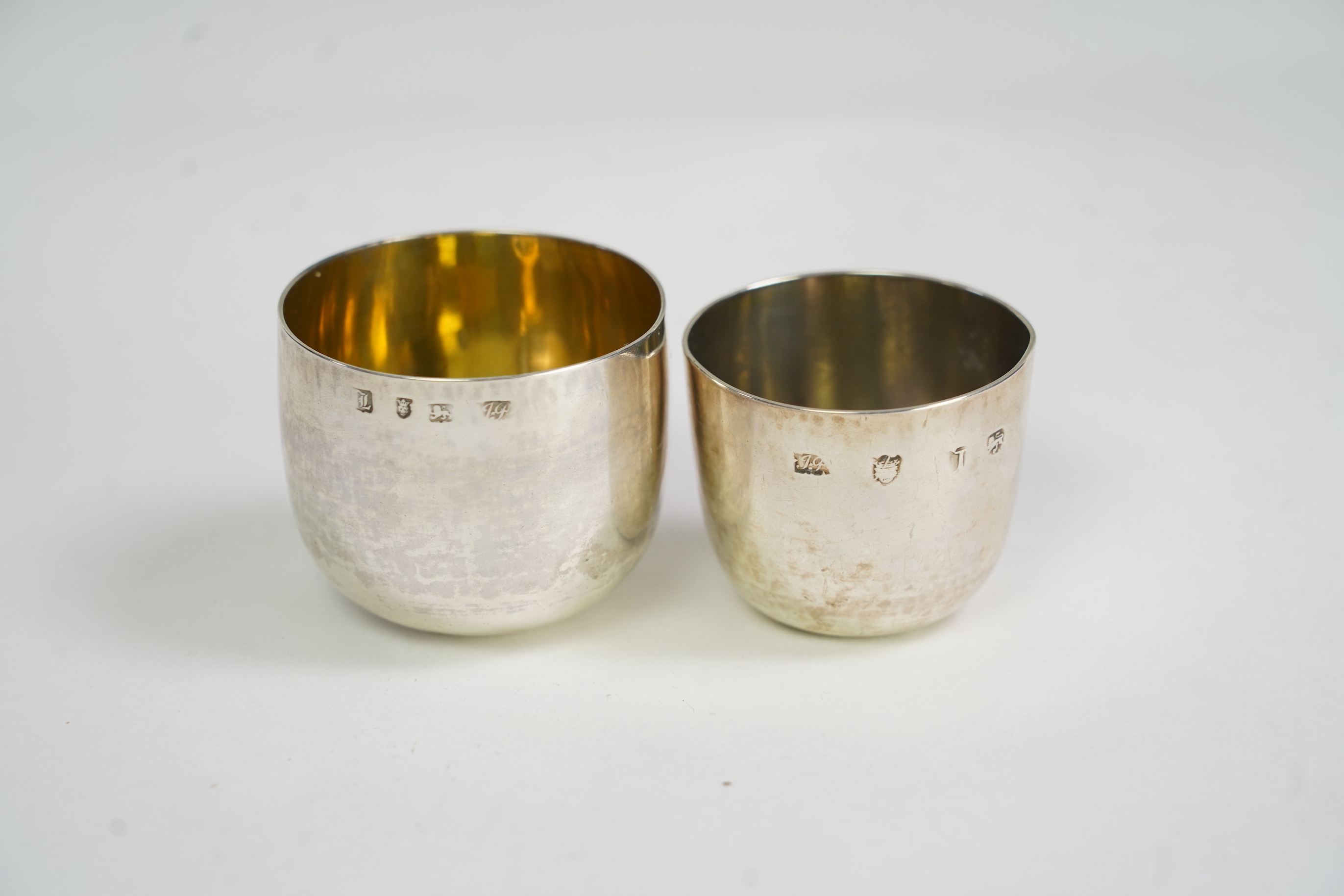 A George II silver tumbler cup by John Payne, London, 1753?, engraved with the initial MA, 45mm, together with a later George III silver tumbler cup by John Payne, London, 1766, engraved with the initials, A.M.A